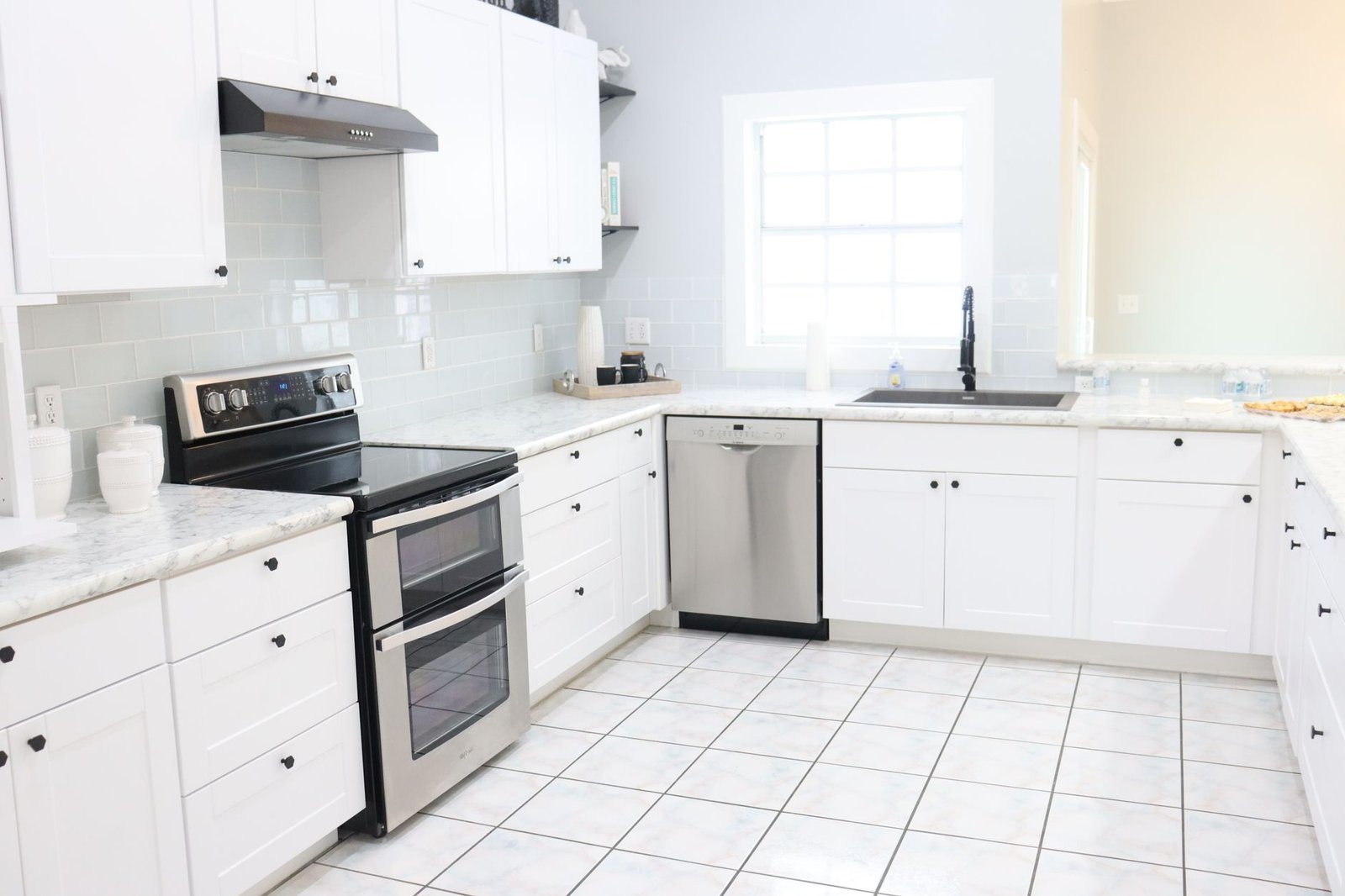 Freshly refinished white kitchen cabinets